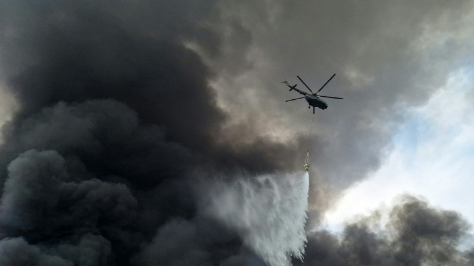 Iran's president visits site of port blast that killed 28 