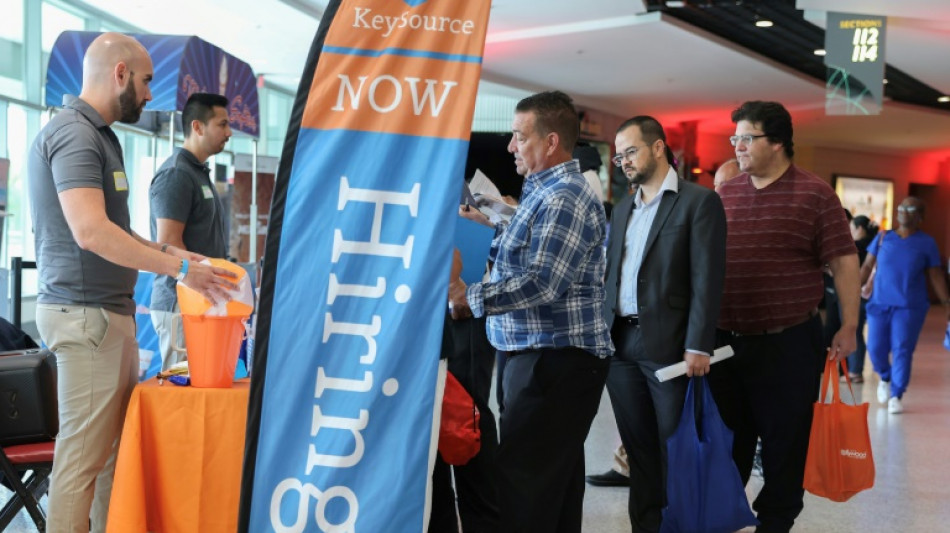 US hiring slows less than expected, unemployment unchanged