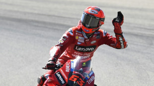 Bagnaia breaks lap record to take pole in Aragon MotoGP