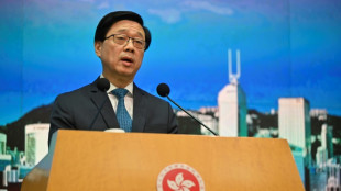 Wanted activists should surrender&nbsp;or 'spend days in fear': Hong Kong leader
