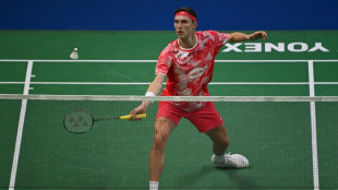 Emotional Axelsen well beaten on return from six months out