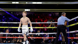 Inoue knocked down but stops Cardenas in eighth to keep crown
