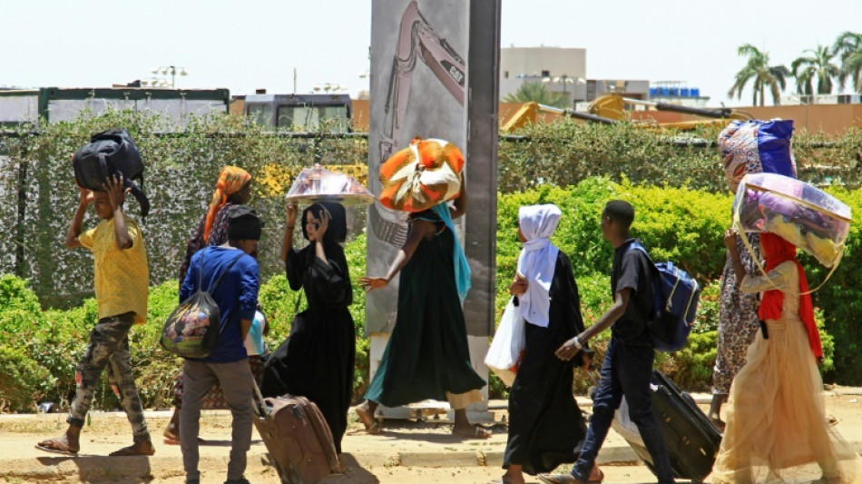 Thousands flee Sudan capital as clashes rage despite truce