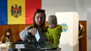 Moldova votes in tense polls, torn between EU and Russia