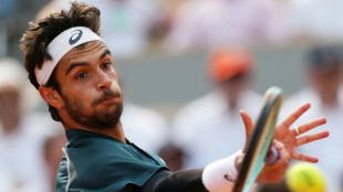 Musetti fights past Tiafoe to meet Alcaraz in French Open semis