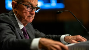 US stocks finish higher as markets gyrate on Powell firing fears