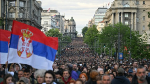 Protesters block motorway in Serbian capital after mass shootings
