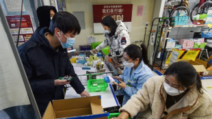 Menschen mit Corona-Symptomen k&ouml;nnen in chinesischer Metropole zur Arbeit gehen