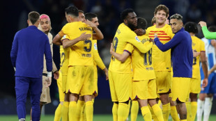 Barcelona earn La Liga title with Espanyol rout