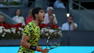 Alcaraz retains Madrid Open title in battling win over Struff