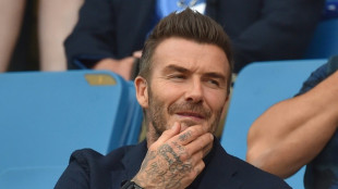 Beckham joins thousands in queue for queen's coffin