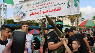 Hamas lets Gaza residents pose with weapons for first time