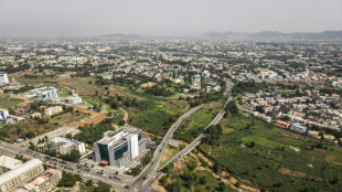 Nigerian farms battle traffic, developers in downtown Abuja
