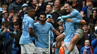 Man City thrash Liverpool but Jesus keeps Arsenal eight points clear