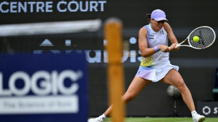 Swiatek sweeps past Paolini into first grass-court final in Germany