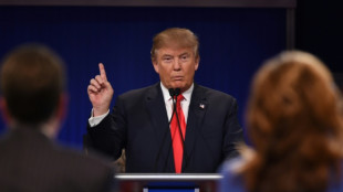 Absent Trump set to steal show at Republican debate