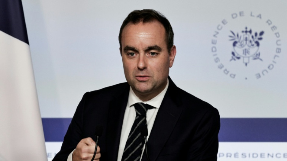 France PM to force budget into law, concedes 'partial failure'