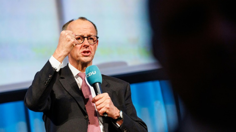 El socialdem&oacute;crata Olaf Scholz y el conservador Friedrich Merz en un pulso por el poder en Alemania