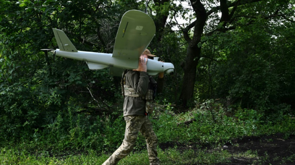 Ukrainians fly locally-made drones to sharpen artillery aim