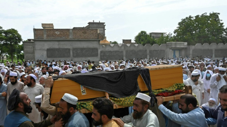 Pakistan police comb bomb site after deadly blast
